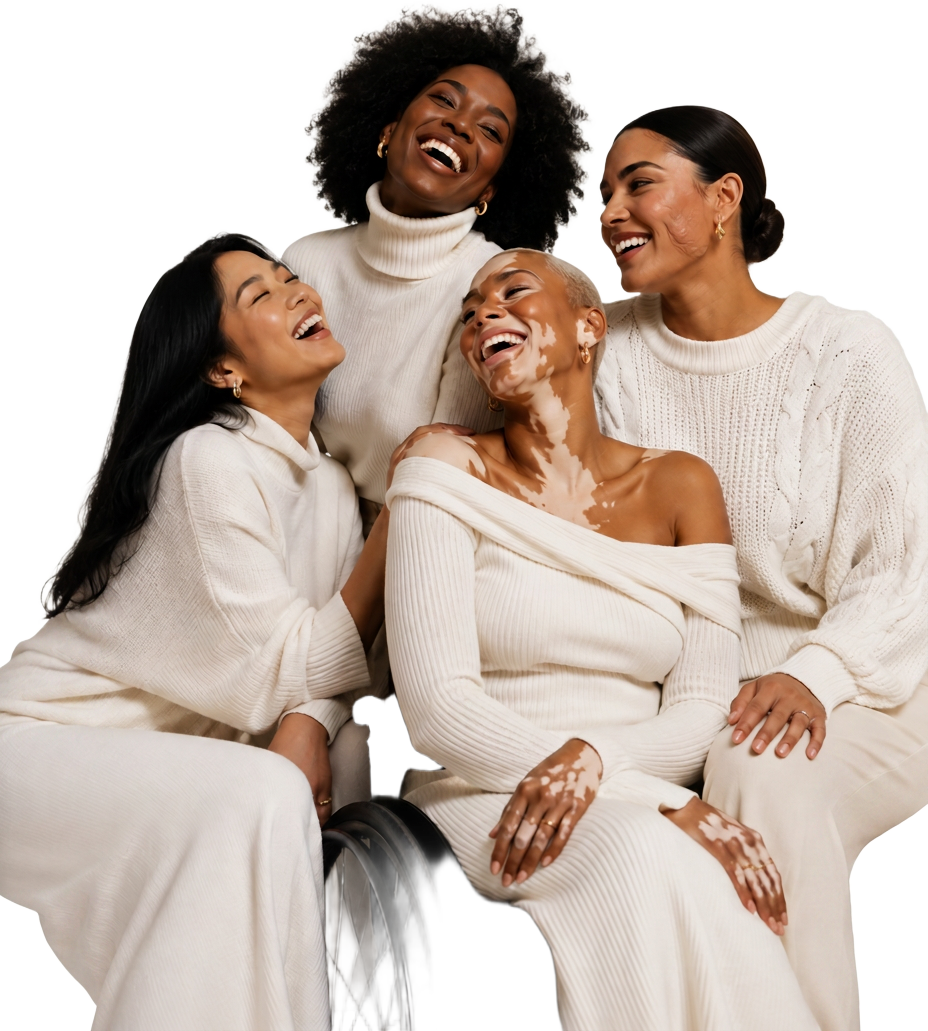 Four women of different backgrounds laughing together